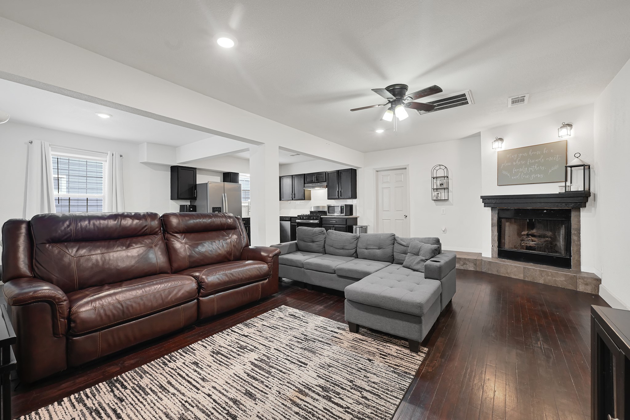207 Wafer Street Pasadena, TX 77506 - Photo 5 of 26 a living room with furniture and a fireplace