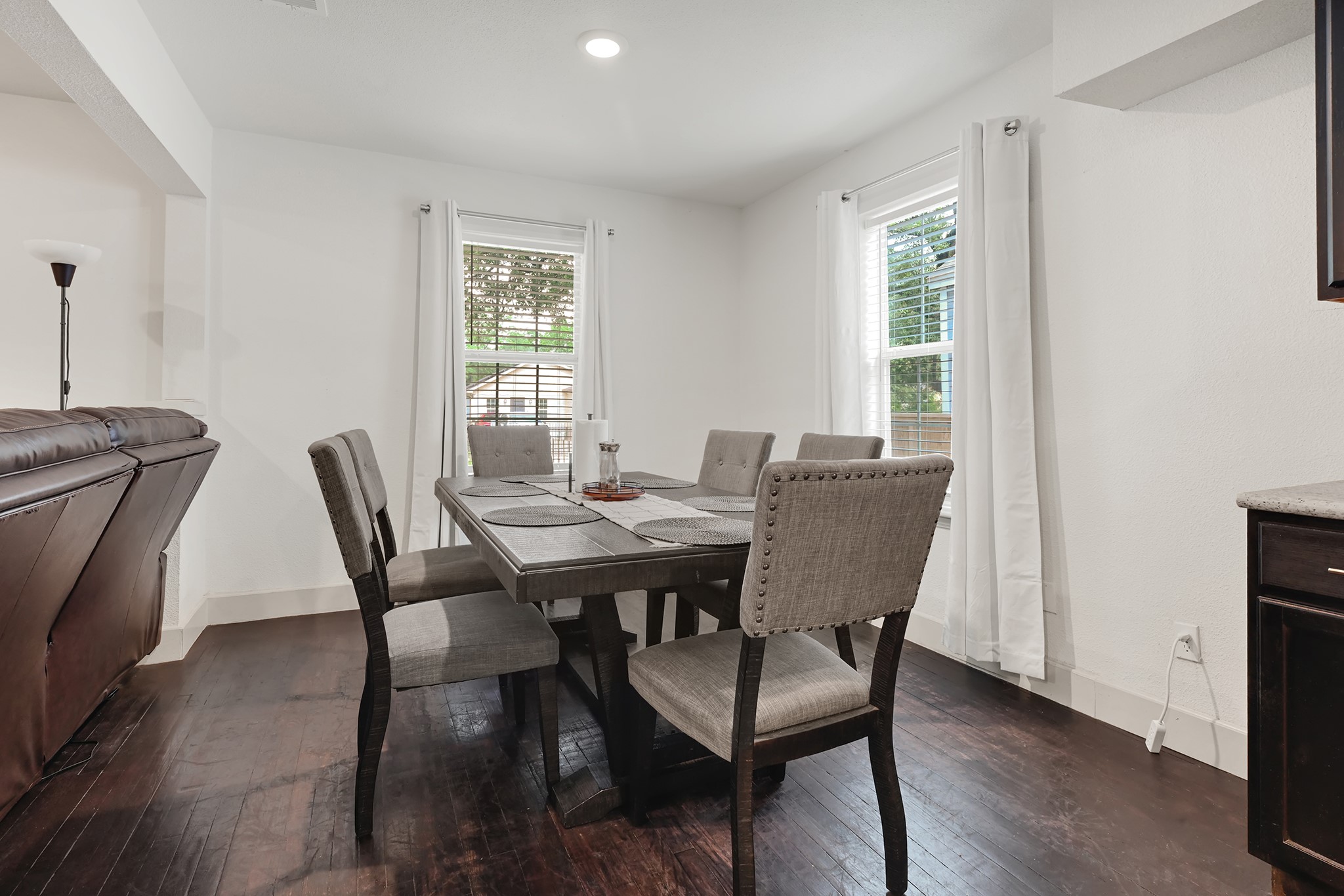 207 Wafer Street Pasadena, TX 77506 - Photo 7 of 26 a view of a dining room with furniture window and wooden floor