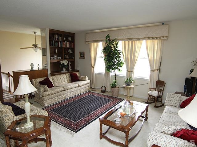 5522 Earl Road Durham, NC 27712 - Photo 3 of 13 a living room with furniture a rug and a large window