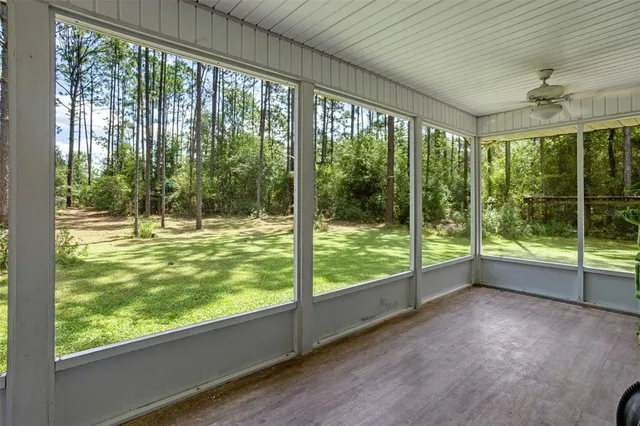 a view of a swimming pool with chairs