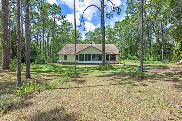 a front view of house with yard and seating area