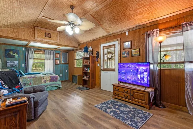 a backyard of a house with a yard and plants