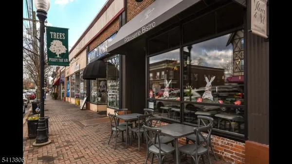 a view of cafe with outdoor sitting area