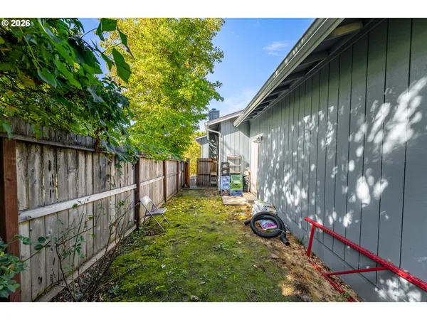 a view of a backyard of the house