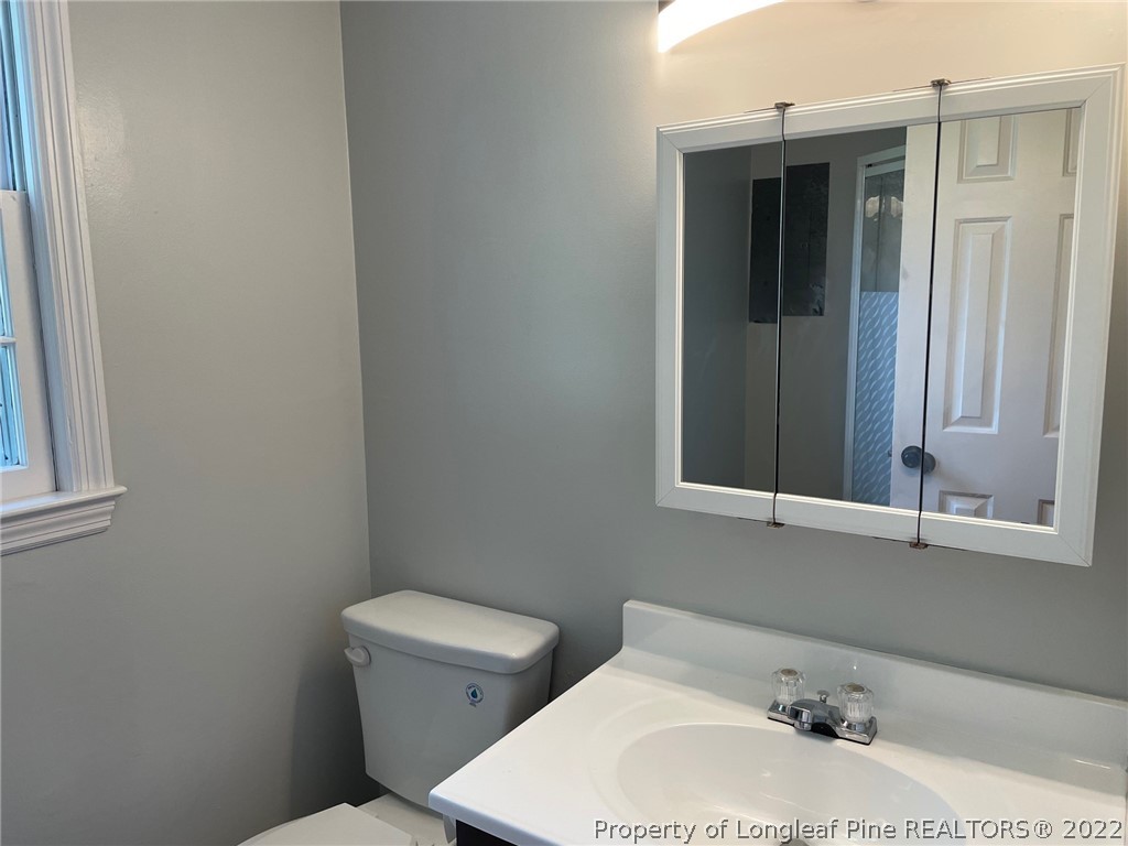 1714 Valley Ridge Drive Fayetteville, NC 28303 - Photo 24 of 32 a bathroom with a sink and a toilet