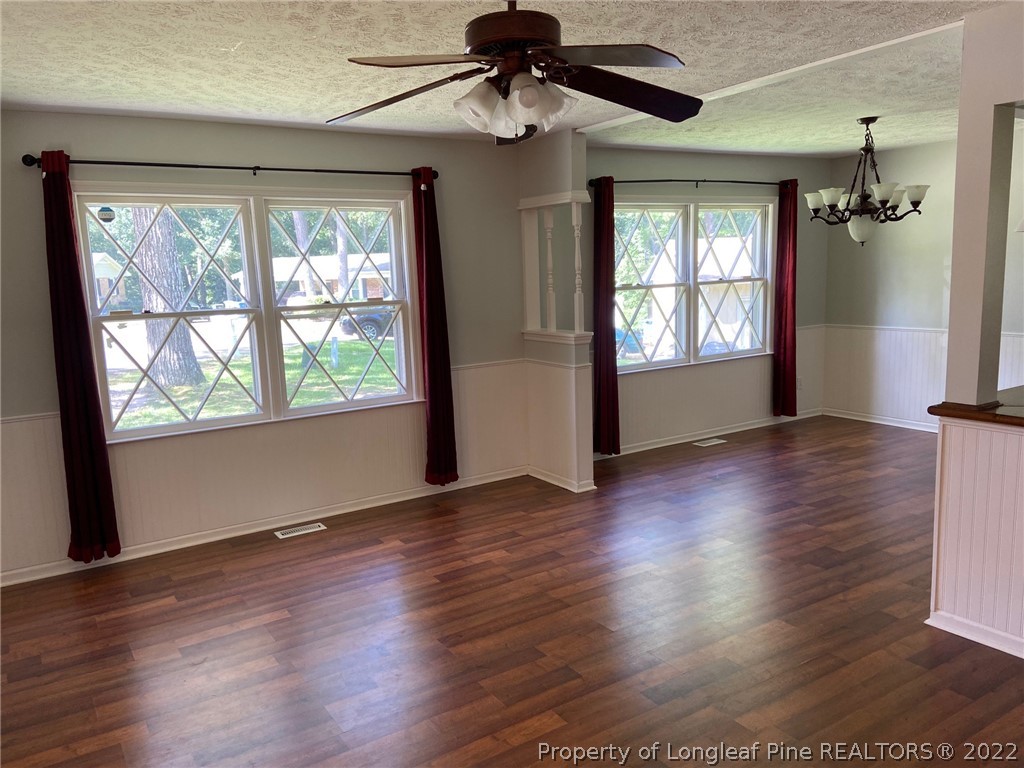 1714 Valley Ridge Drive Fayetteville, NC 28303 - Photo 7 of 32 a view of an empty room with wooden floor and a window