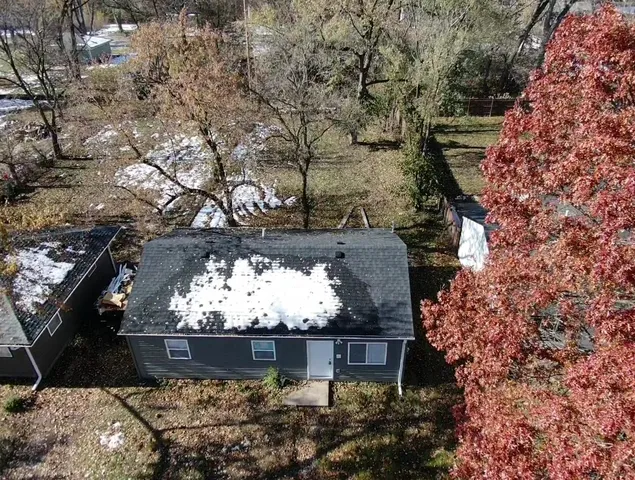 a view of a tree with a yard