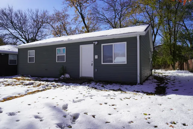 a view of a backyard of the house