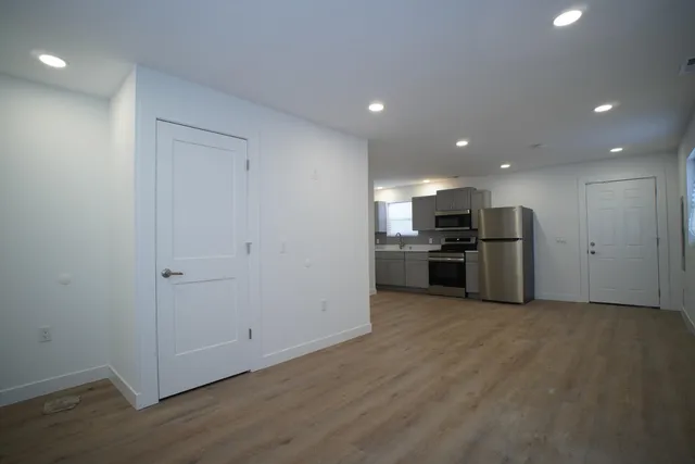 a view of kitchen with stainless steel appliances refrigerator and microwave