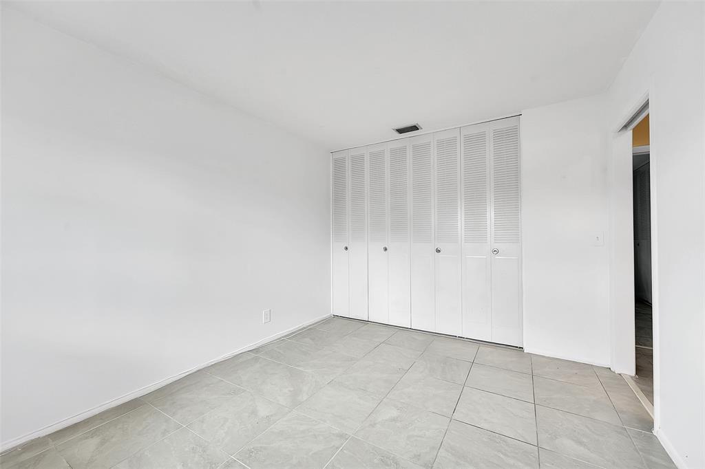 2769 Ashley Drive West, Unit F West Palm Beach, FL 33415 - Photo 13 of 25 a view of an empty room