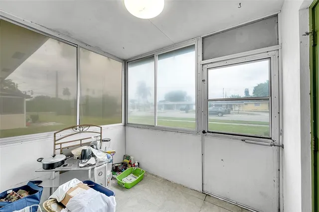 a room with window table and chairs