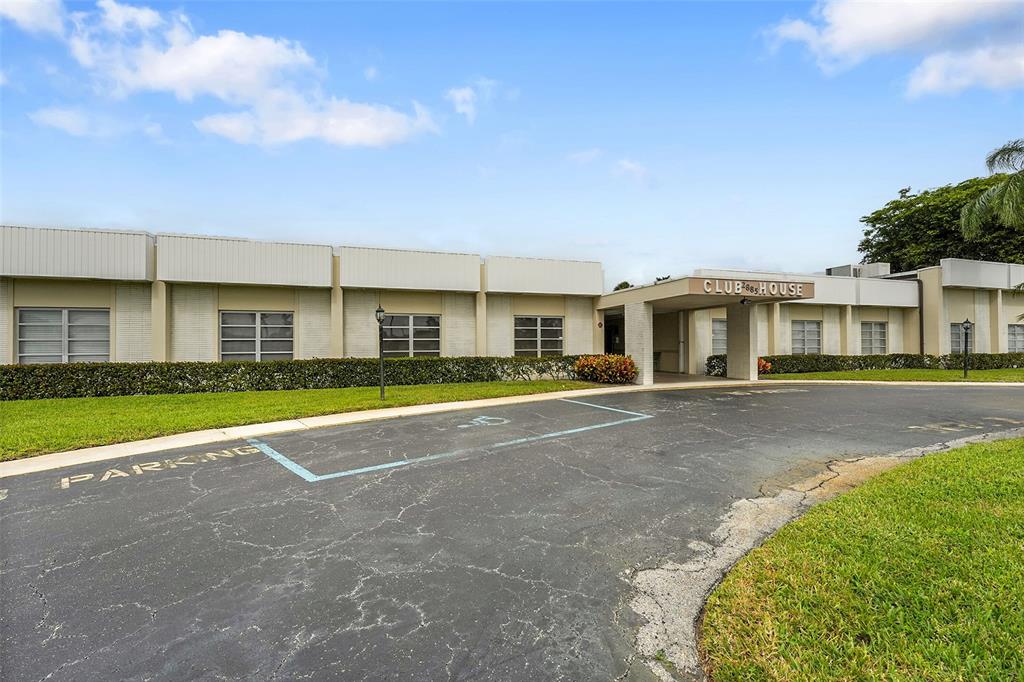 2769 Ashley Drive West, Unit F West Palm Beach, FL 33415 - Photo 20 of 25 a view of an house with a swimming pool