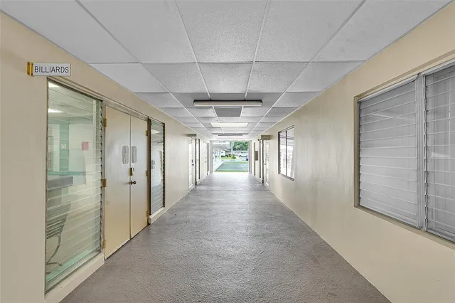 a view of a hallway with a window