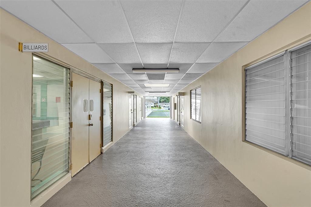 2769 Ashley Drive West, Unit F West Palm Beach, FL 33415 - Photo 21 of 25 a view of a hallway
