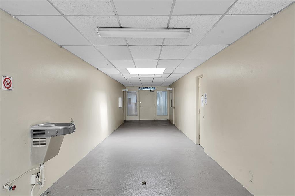 2769 Ashley Drive West, Unit F West Palm Beach, FL 33415 - Photo 22 of 25 a view of a hallway with a window