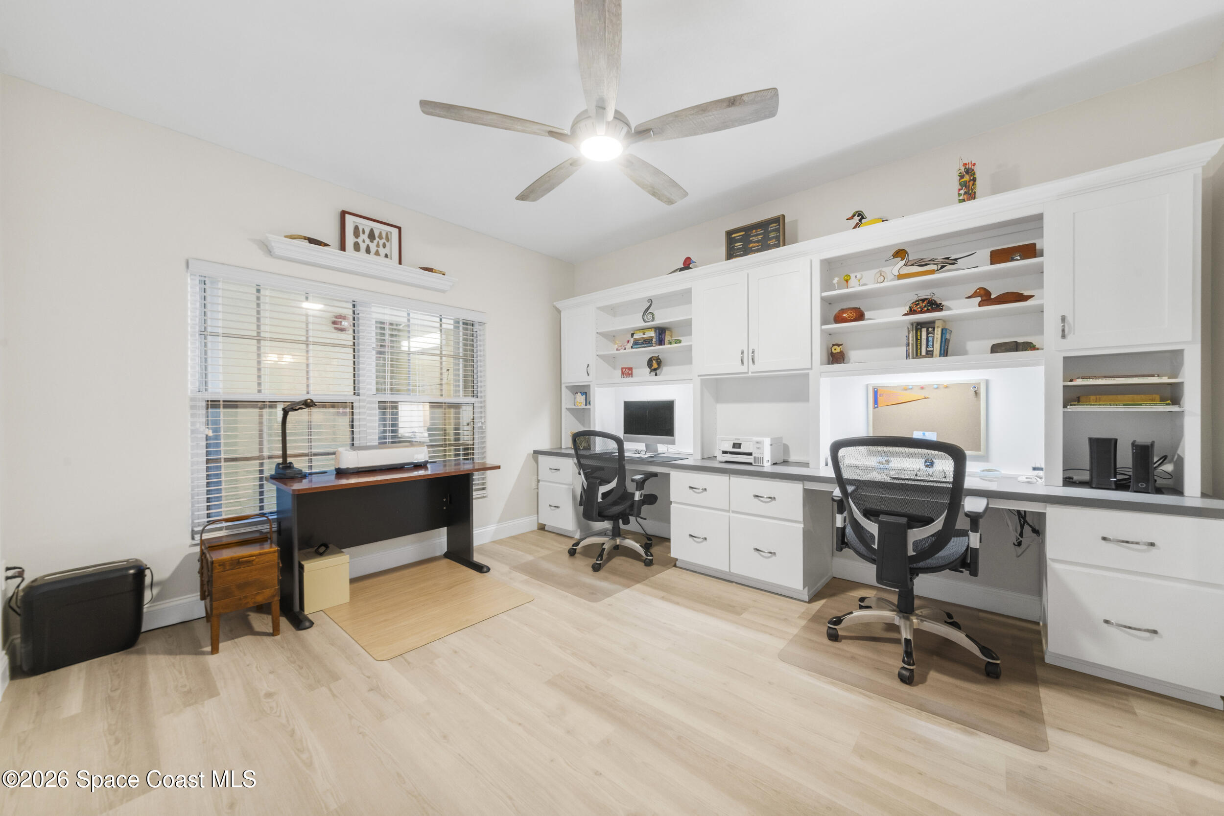 4955 Dixie Highway Northeast, Unit 702 Palm Bay, FL 32905 - Photo 13 of 54 a view of a workspace with furniture and a window
