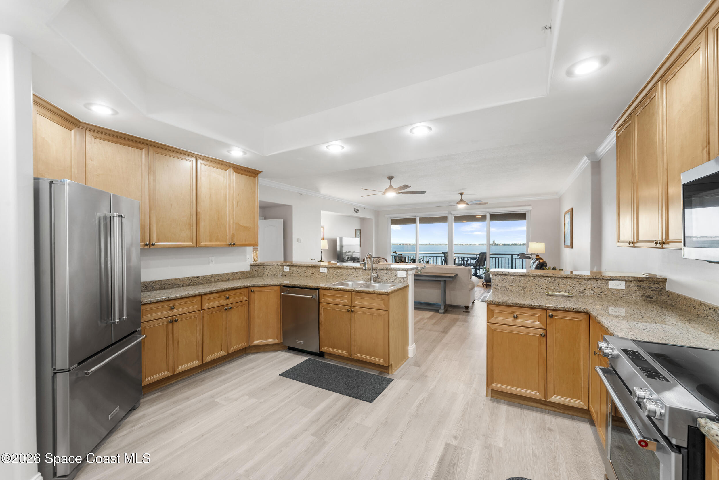 4955 Dixie Highway Northeast, Unit 702 Palm Bay, FL 32905 - Photo 20 of 54 a kitchen with lots of counter top space and stainless steel appliances