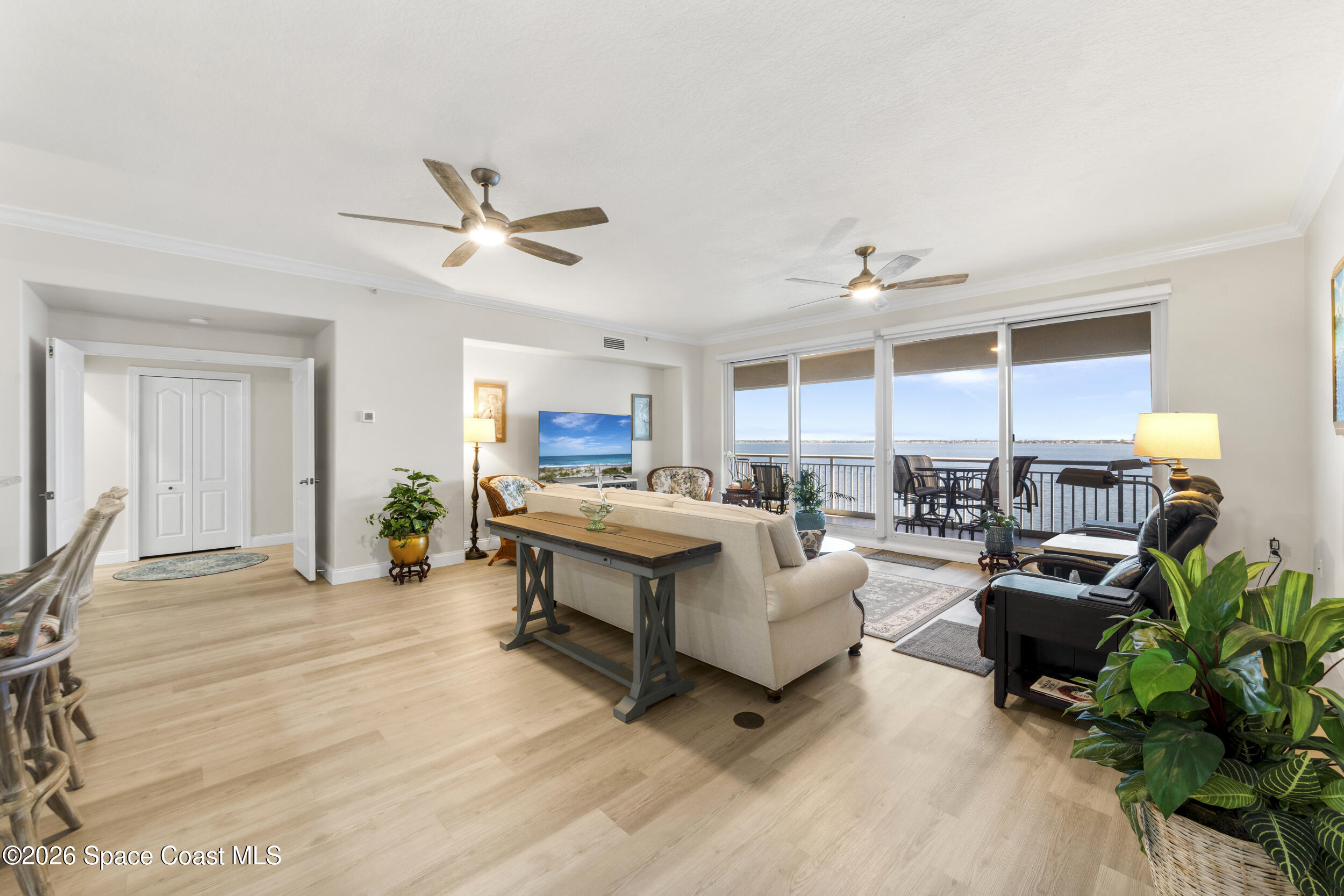 4955 Dixie Highway Northeast, Unit 702 Palm Bay, FL 32905 - Photo 23 of 54 a living room with furniture kitchen view and a large window