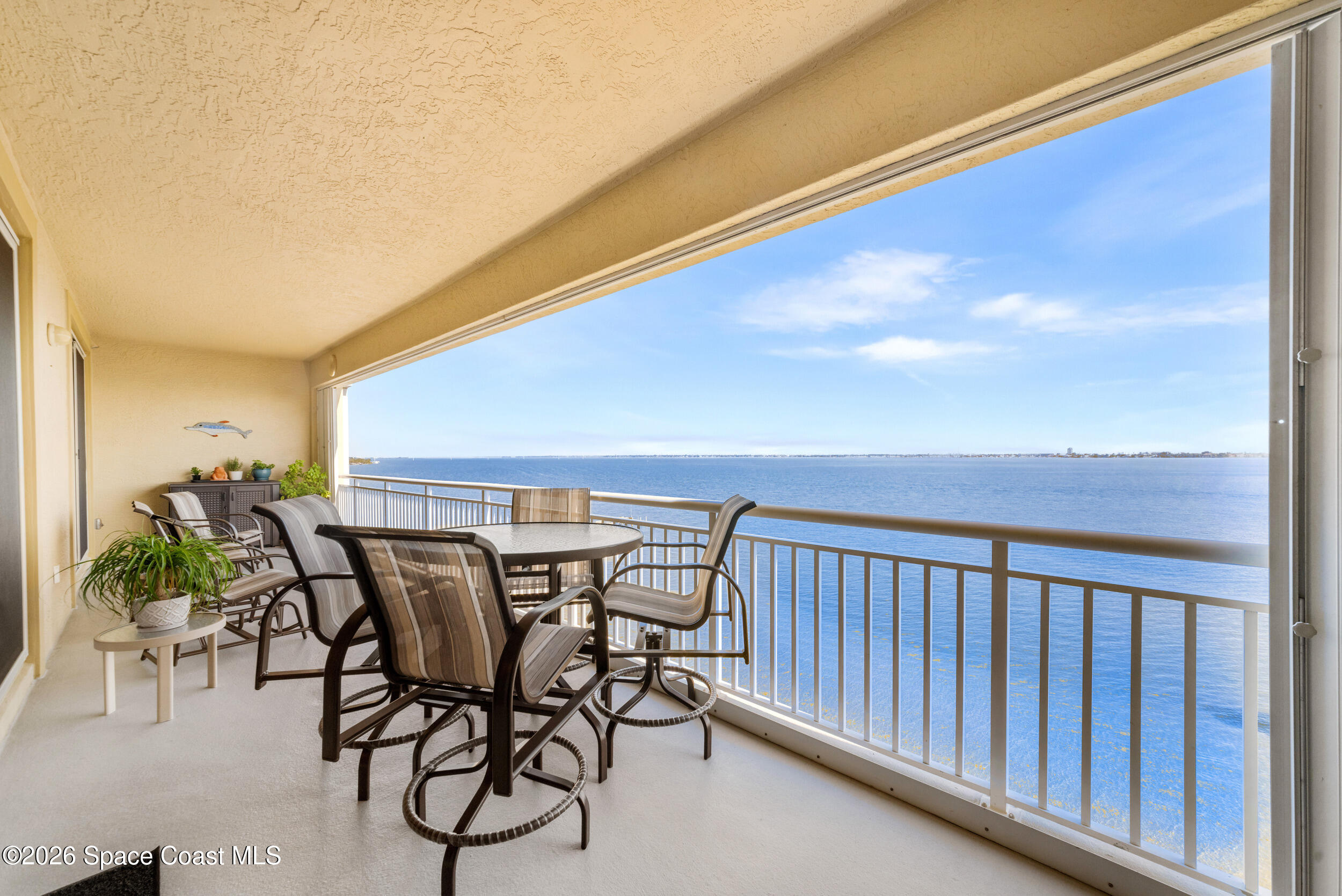 4955 Dixie Highway Northeast, Unit 702 Palm Bay, FL 32905 - Photo 29 of 54 a view of a chairs and table in patio
