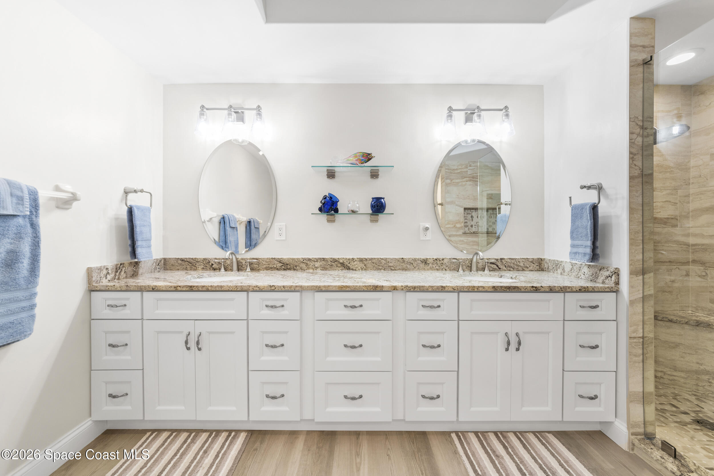 4955 Dixie Highway Northeast, Unit 702 Palm Bay, FL 32905 - Photo 33 of 54 a bathroom with granite countertop a sink and a mirror