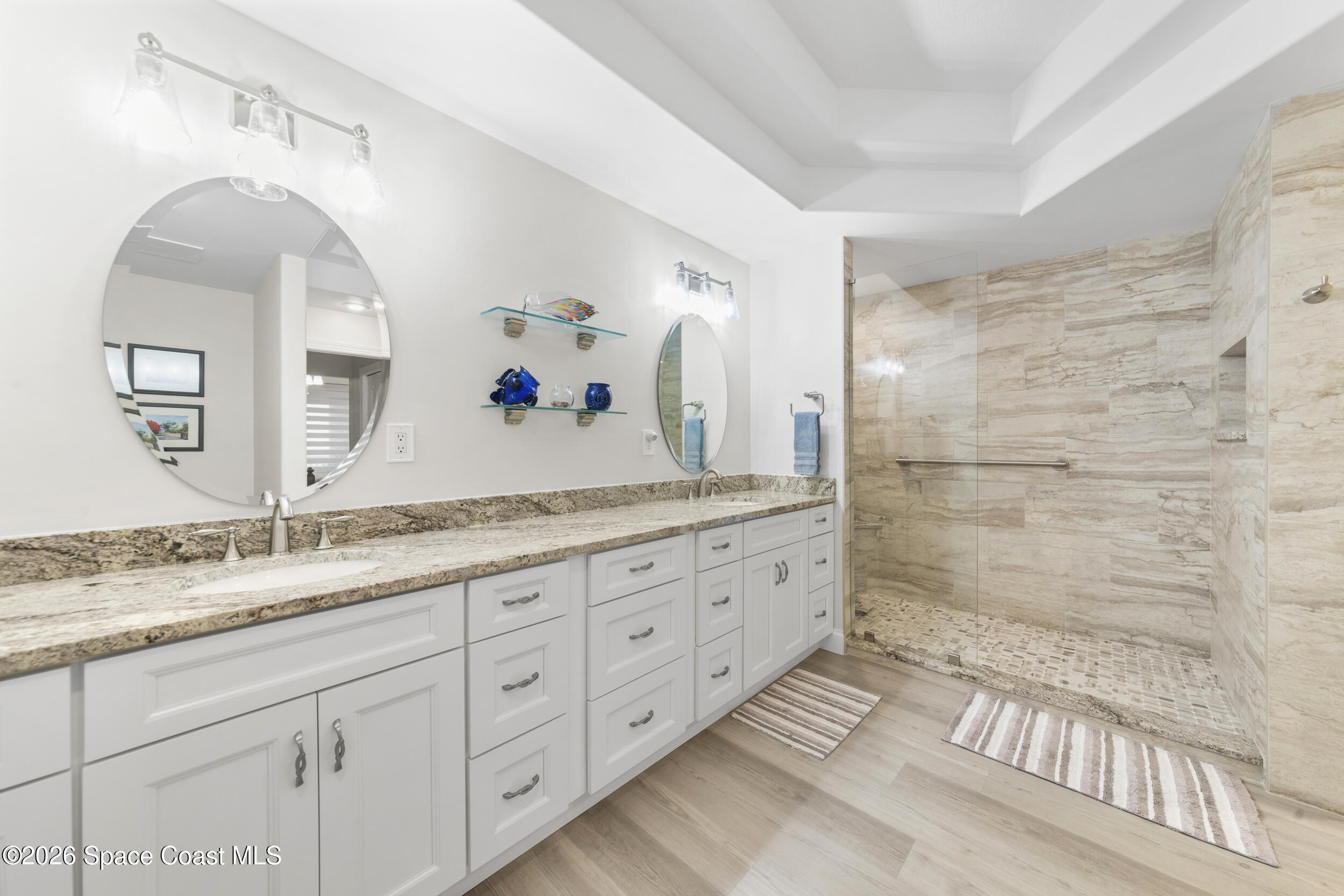 4955 Dixie Highway Northeast, Unit 702 Palm Bay, FL 32905 - Photo 34 of 54 a spacious bathroom with double sink and a mirror