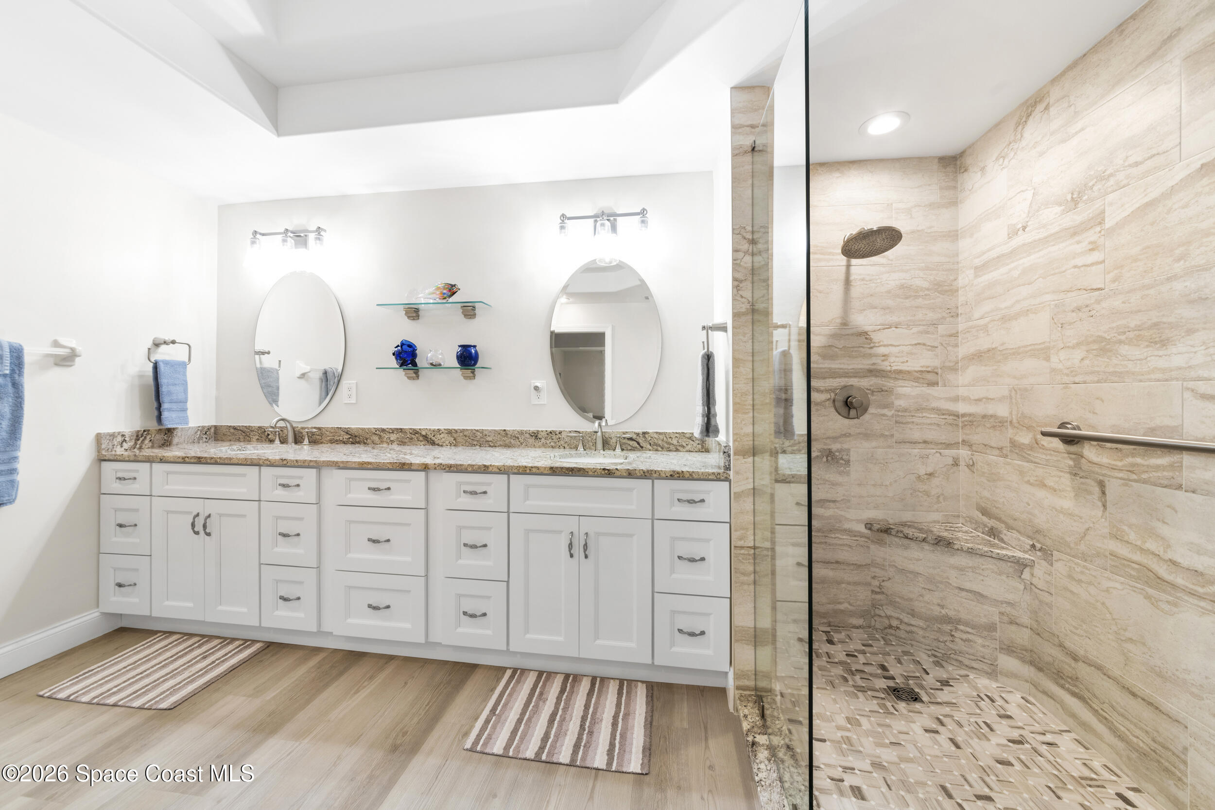 4955 Dixie Highway Northeast, Unit 702 Palm Bay, FL 32905 - Photo 35 of 54 a bathroom with a granite countertop sink and a mirror