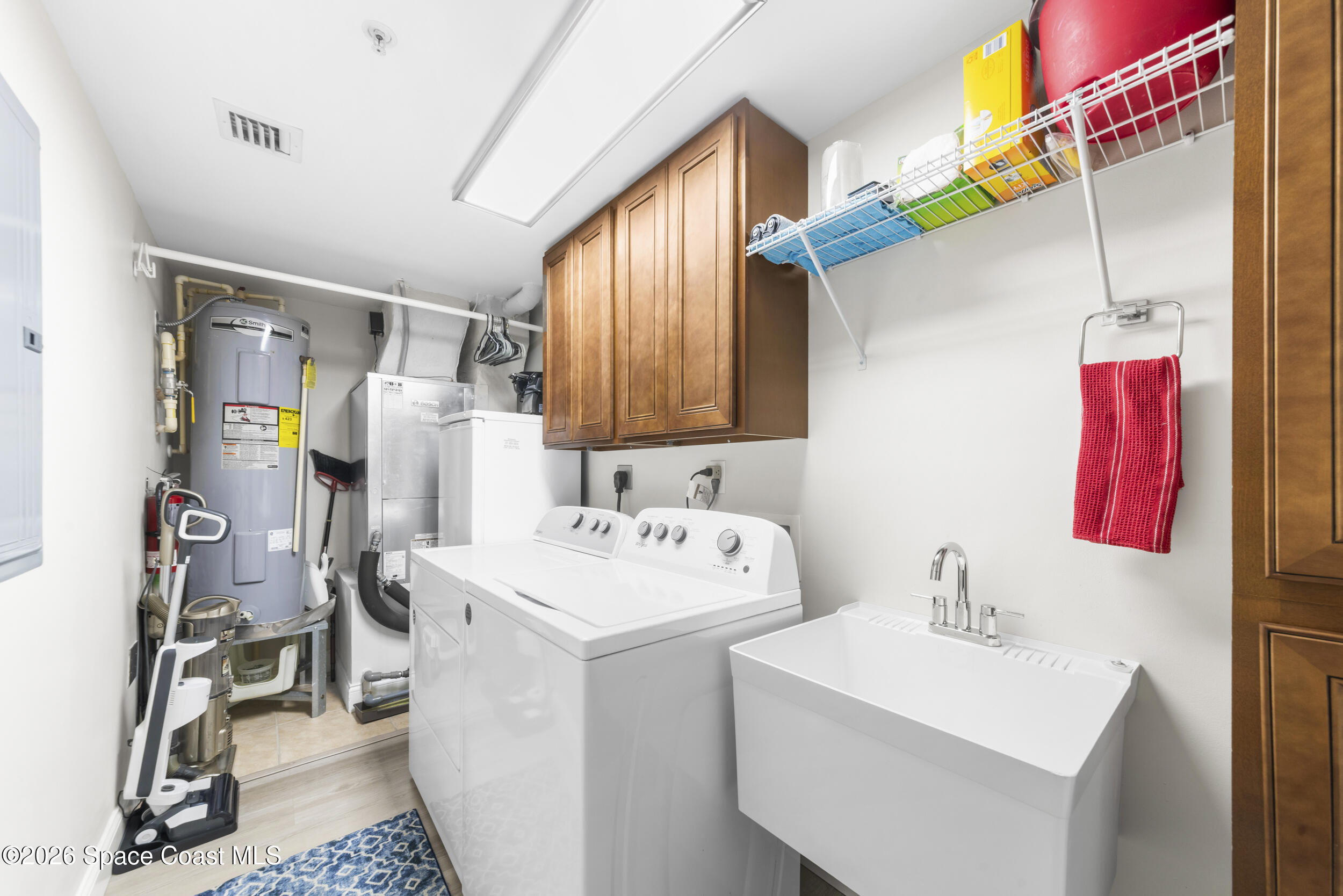 4955 Dixie Highway Northeast, Unit 702 Palm Bay, FL 32905 - Photo 37 of 54 a utility room with dryer and washer