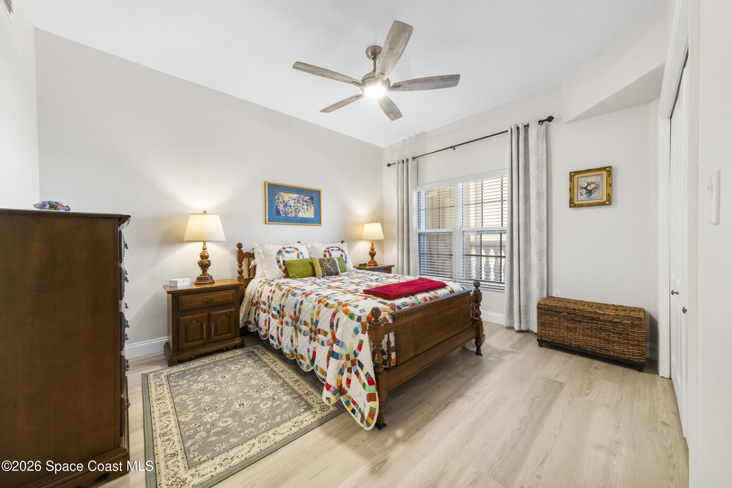 4955 Dixie Highway Northeast, Unit 702 Palm Bay, FL 32905 - Photo 9 of 54 a bedroom with a bed dresser and window