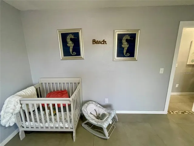 a bedroom with a bed and couch