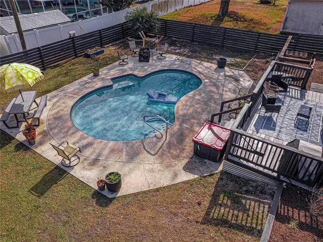 swimming pool view with a sitting space