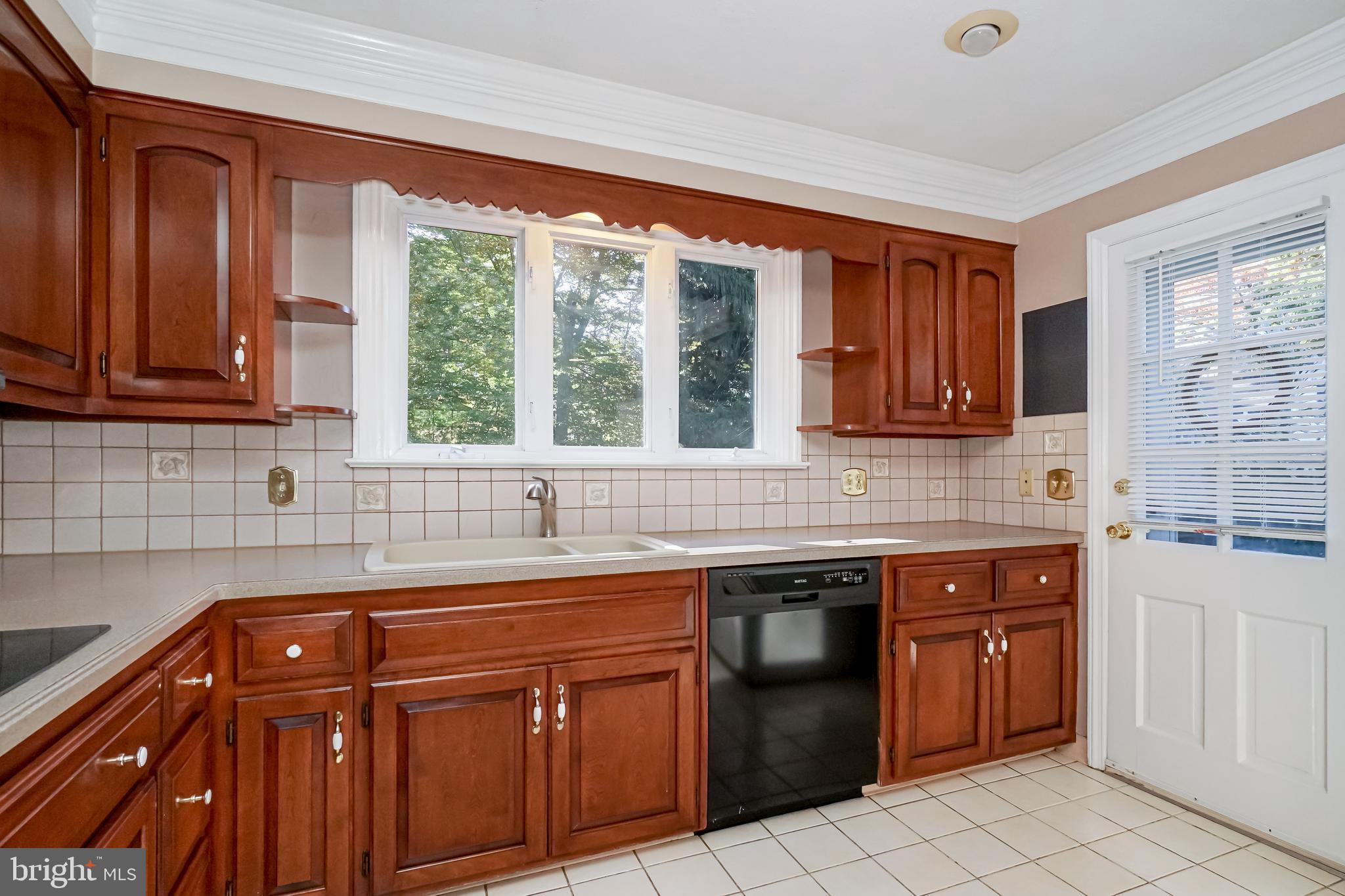 202 Welwyn Road Wilmington, DE 19803 - Photo 11 of 30 Large Window above the sink and Tile Backsplash