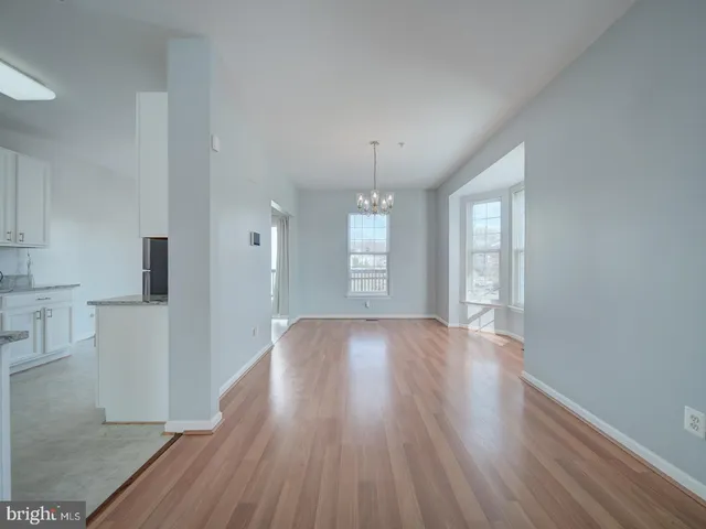 a bathroom with a sink a toilet and a large mirror