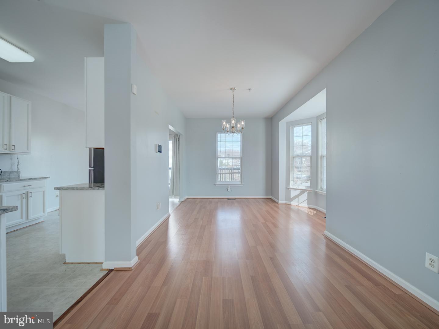 4016 Tidewood Road Baltimore, MD 21220 - Photo 17 of 40 wooden floor in an empty room with a window