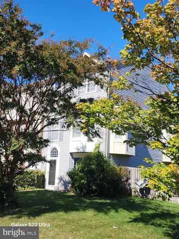 a view of house with yard in background