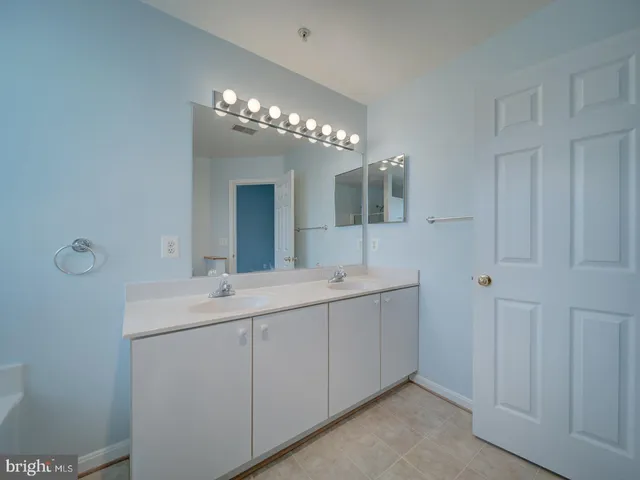 a white bath tub sitting next to a window
