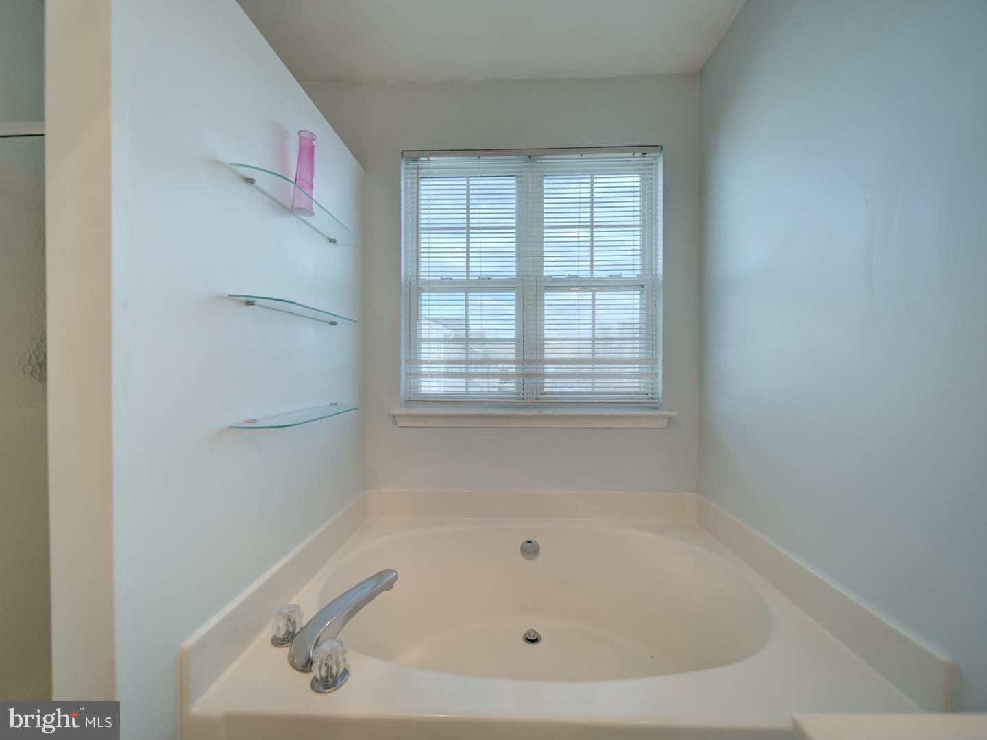 4016 Tidewood Road Baltimore, MD 21220 - Photo 33 of 40 a white bath tub sitting next to a window