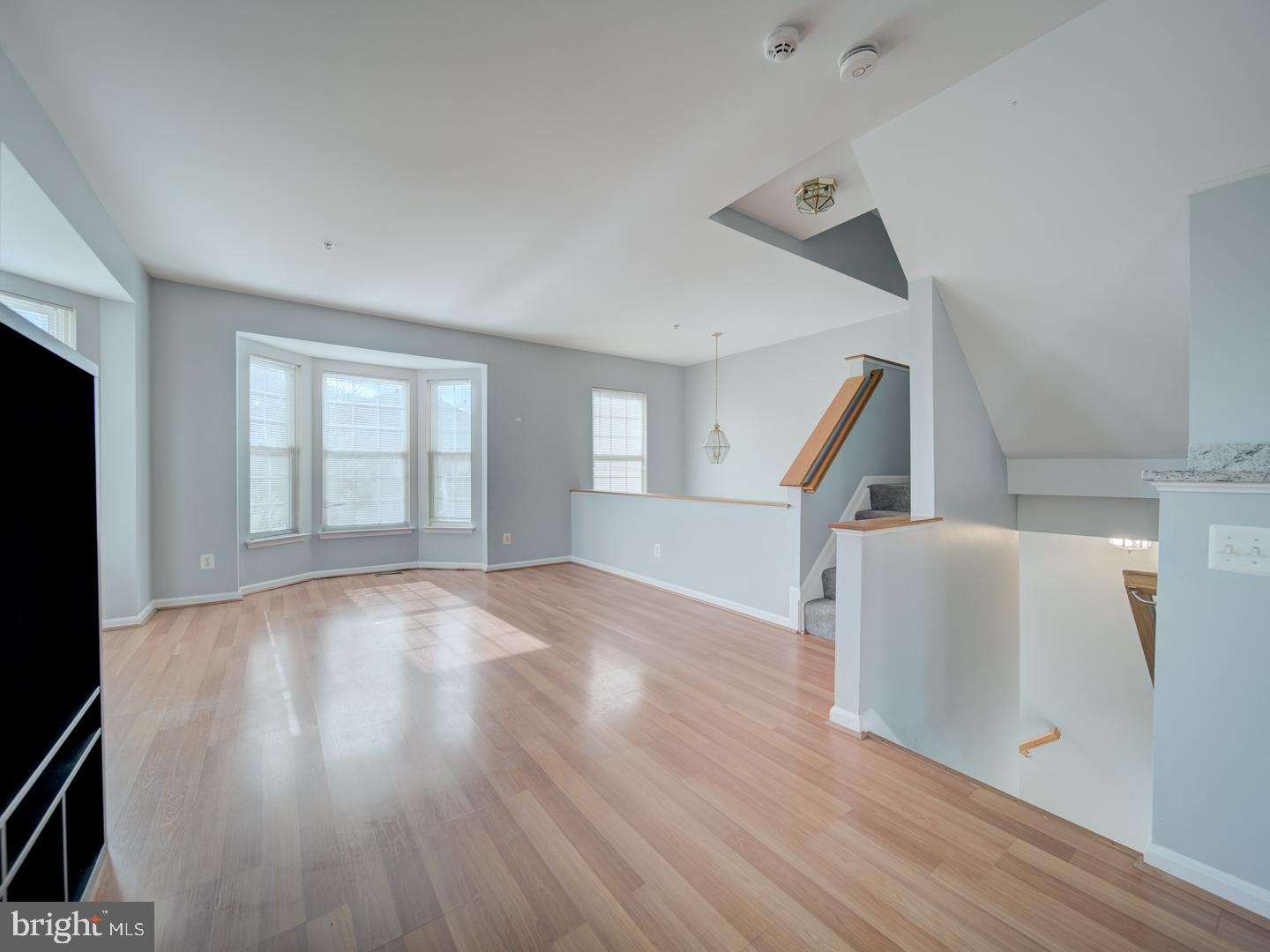 4016 Tidewood Road Baltimore, MD 21220 - Photo 6 of 40 a view of an empty room with wooden floor and a window