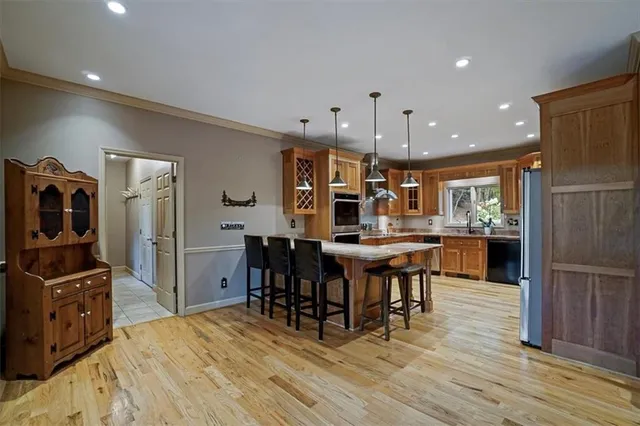 a view of livingroom with furniture wooden floor and a floor to ceiling window