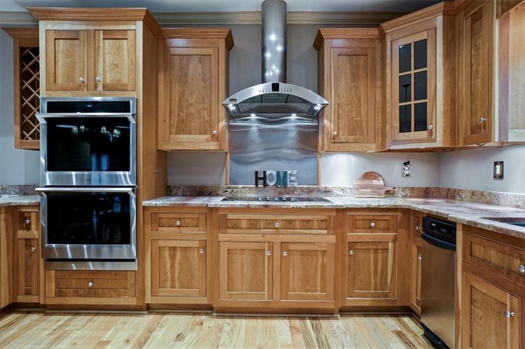 188 Tea Berry Lane Jasper, GA 30143 - Photo 16 of 68 a kitchen with granite countertop a sink and cabinets
