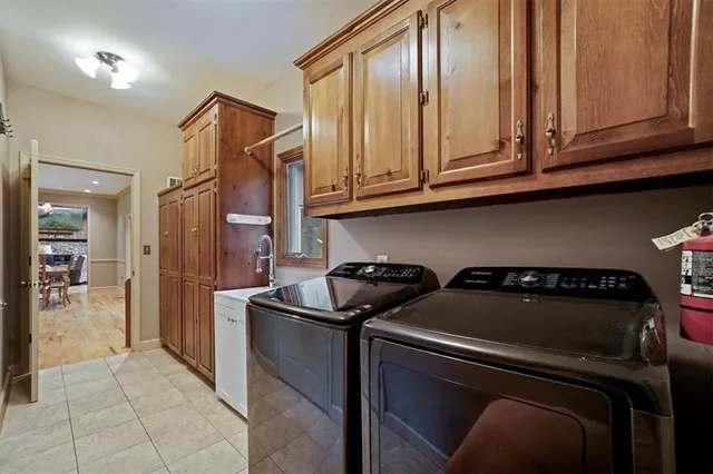 a view of hallway with window and wooden floor