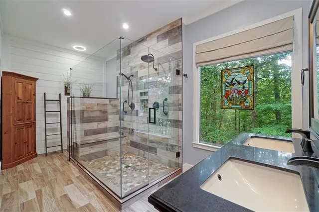 a bathroom with a sink a vanity and a mirror