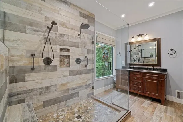 a view of walk in closet with empty racks