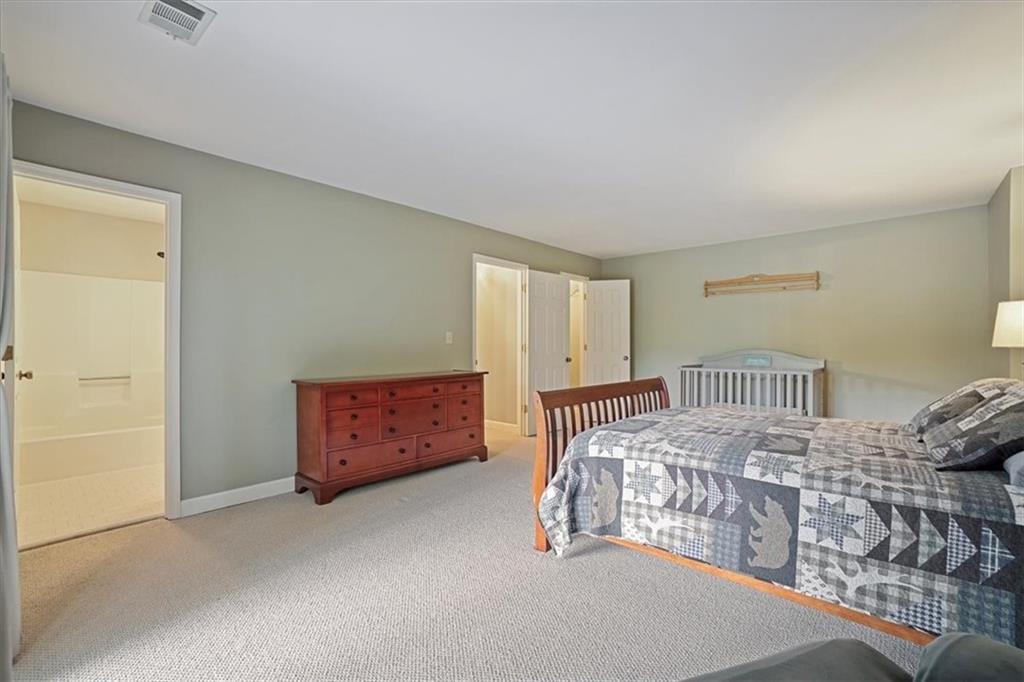 188 Tea Berry Lane Jasper, GA 30143 - Photo 36 of 68 a bedroom with a bed and a painting on the wall