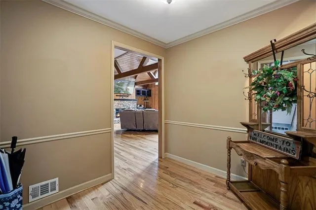 a view of kitchen with furniture and wooden floor