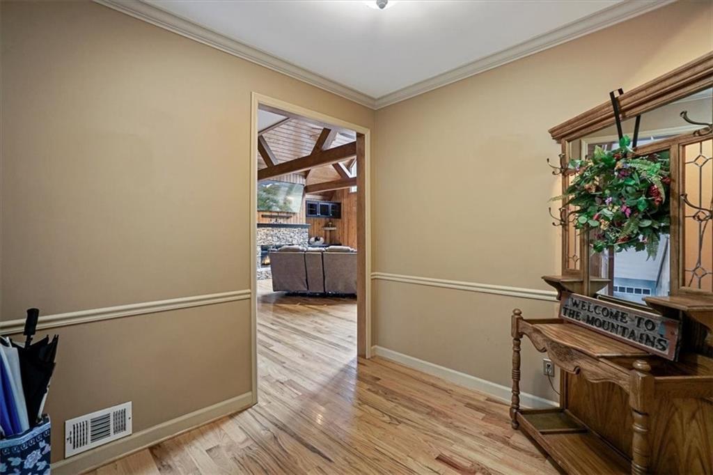 188 Tea Berry Lane Jasper, GA 30143 - Photo 4 of 68 a kitchen with wooden floor and a stove top oven