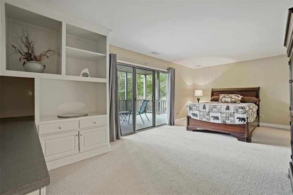 188 Tea Berry Lane Jasper, GA 30143 - Photo 41 of 68 a spacious bedroom with a bed and a large window