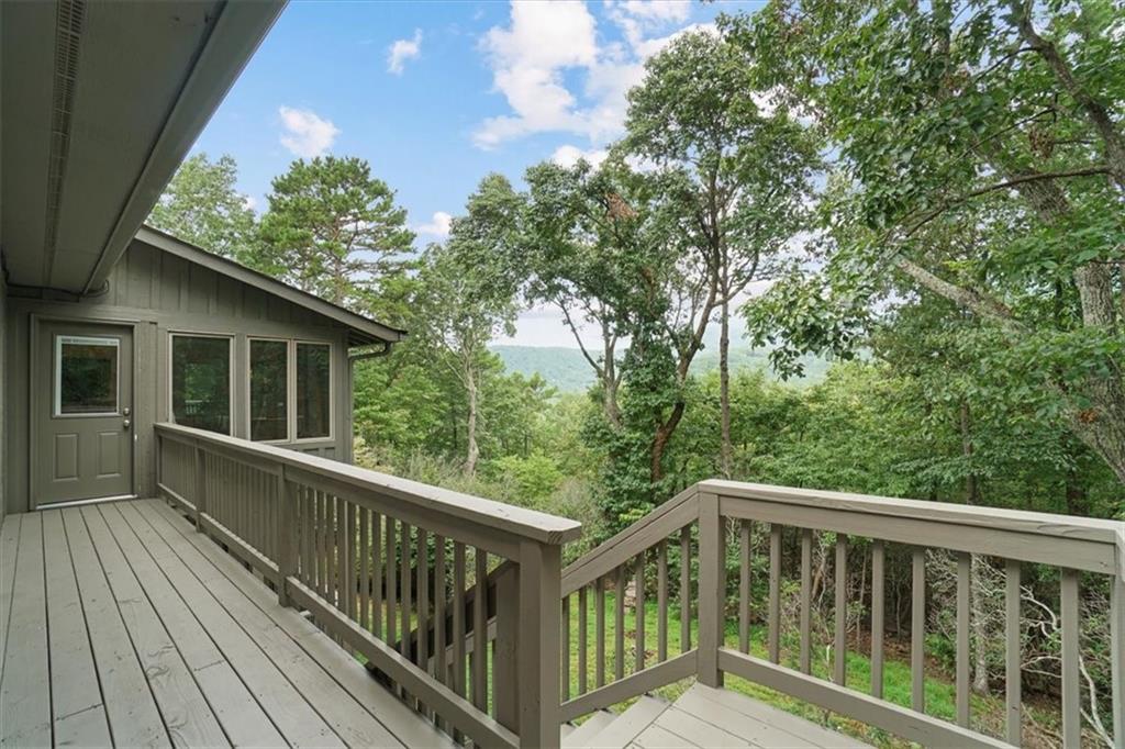 188 Tea Berry Lane Jasper, GA 30143 - Photo 51 of 68 a view of a balcony with wooden floor