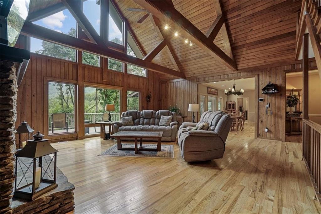 188 Tea Berry Lane Jasper, GA 30143 - Photo 6 of 68 a living room with furniture a wooden floor and next to a window