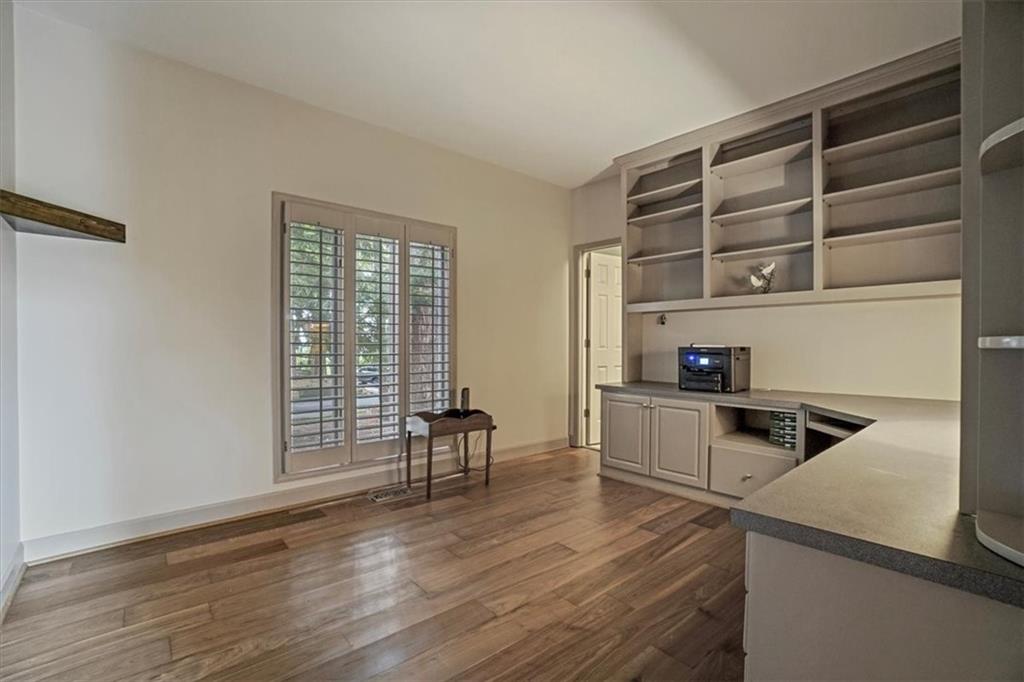 188 Tea Berry Lane Jasper, GA 30143 - Photo 7 of 68 a kitchen with a refrigerator and wooden cabinets