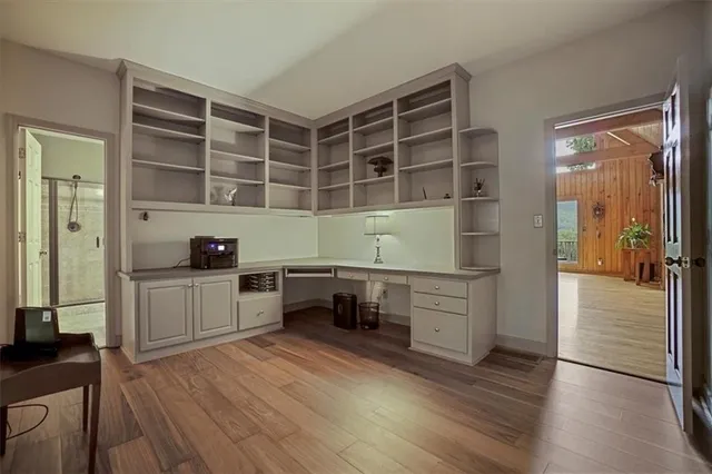 a view of a dining room with furniture and wooden floor